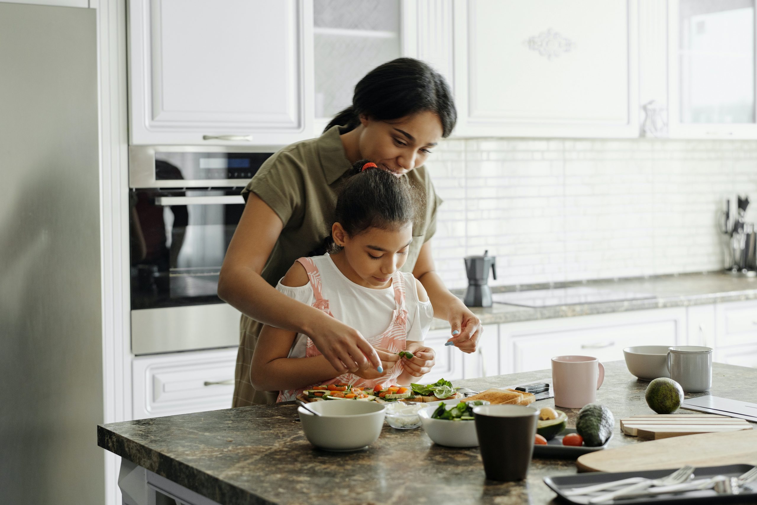 Photo of mother and child preparing food